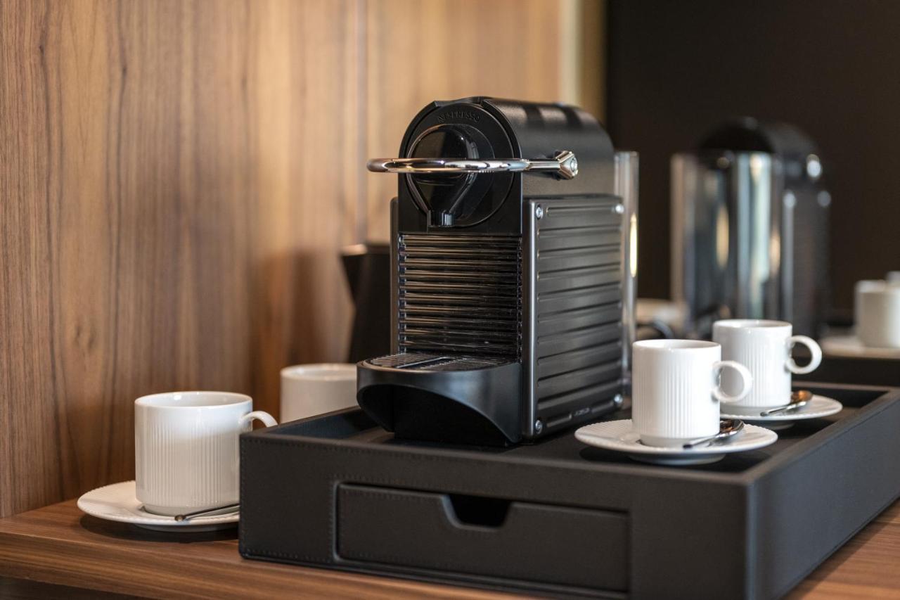 Renaissance Porto Lapa Hotel Exterior photo A Nespresso coffee machine